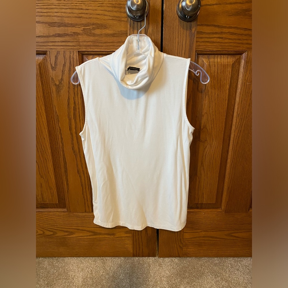 Women Sleeveless T Neck.Size Small. Off white color. Nonsmoking home